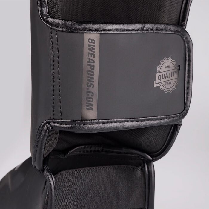 ЗБРОЇ Щитки для гомілок Unlimited 2.0, матово-чорні, для тренувань та змагань, високоякісна синтетична шкіра та ідеальна амортизація, муай-тай, K1, MMA, карате та кікбоксинг, 8