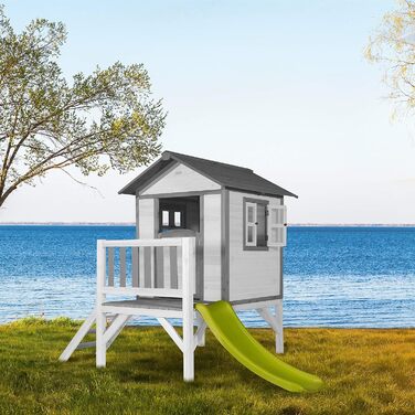 Ігровий будиночок AXI Beach Lodge XL в білому кольорі зі світло-зеленою гіркою Будиночок на палях з деревини FSC для дітей Невелика ігрова вежа для саду.