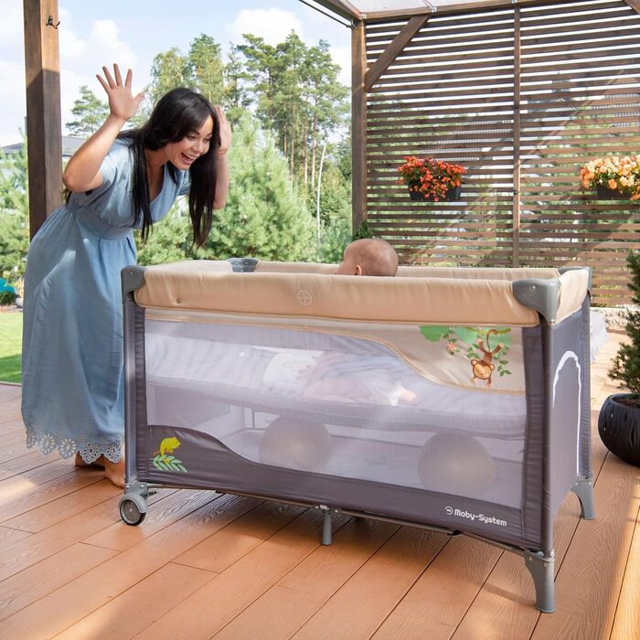 Дорожнє ліжечко-манеж Moby-System Huxley 2-в-1 з пеленальною підкладкою, 2 матрацами, москітною сіткою, сумкою для перенесення - для дітей від 0 до 36 місяців, 128x68x75 см, сірий/рожевий