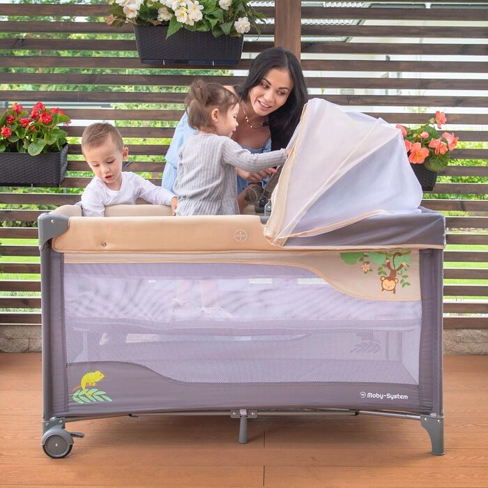 Дорожнє ліжечко-манеж Moby-System Huxley 2-в-1 з пеленальною підкладкою, 2 матрацами, москітною сіткою, сумкою для перенесення - для дітей від 0 до 36 місяців, 128x68x75 см, сірий/рожевий