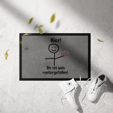 Щось упало на килимок перед дверима. Смішне прислів&39я фігурка з мозку-палички.