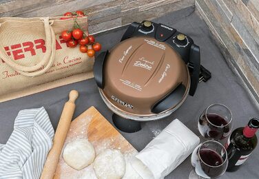 Піца Зовнішнє задоволення, Піч для піци, 1200 Вт, 400C, Скельна вогнетривка (діаметр 31 см), Таймер 5', Кулінарна книга в комплекті, Мідь, 3 Ferrari G10006