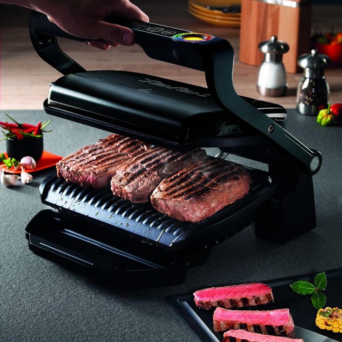 Контактний гриль TEFAL GC7128 OPTIGRILL 6 автоматичних програм Ручний режим з 4 режимами температури Ідеальні результати приготування на грилі завдяки вимірюванню товщини Чорний