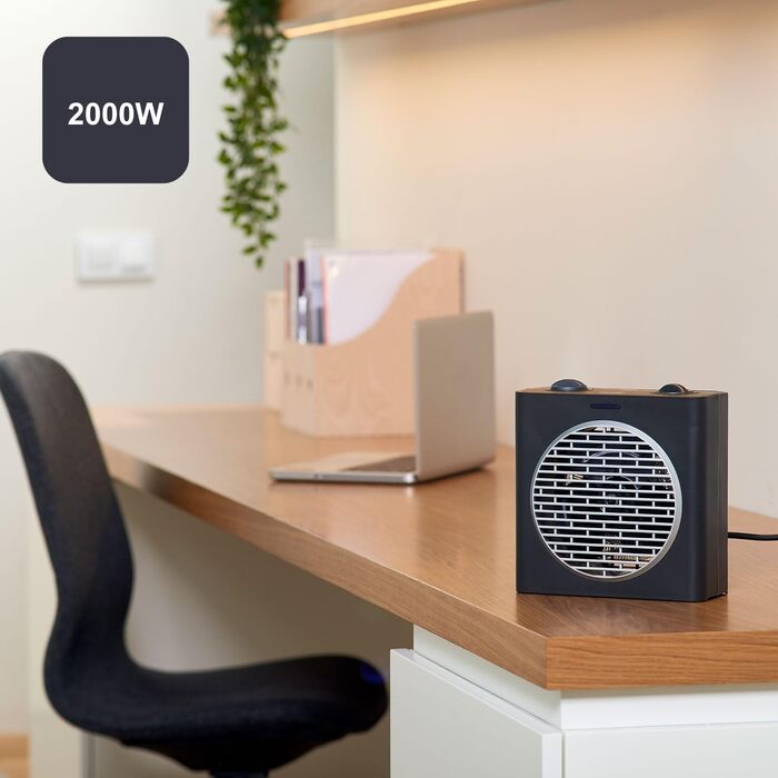 Компактний обігрівач потужністю 2000 Вт Регульовані рівні потужності 3 режими роботи Регульований електронний термостат Система захисту від перекидання Матово-чорний та сірий 2000 Вт Компактний, 2003E