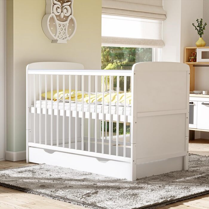Дитяче ліжечко 70x140 см біле, що трансформується в дитяче ліжко &quotНаталі&quot з шухлядою та матрацом з прорізувачами