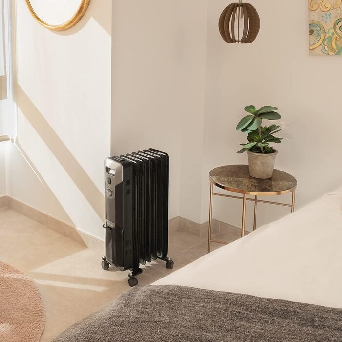 Масляний обігрівач Cecotec ReadyWarm 7000 Space Black 1500 Вт, 7 секцій, 3 режими потужності, відсік для кабелю, зручне керування, ручка, колеса та подвійна система безпеки, чорний, для приміщень до 15 м