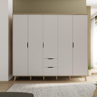 Гардероб Forte VANKKA 230, шафа в скандинавському стилі з 5 дверима на петлях та 2 шухлядами, витончені меблеві ніжки, інженерна деревина, декор дубовими дошками Білий, 228,8 см завширшки x 201,5 см заввишки x 52,7 см завглибшки. Біло-дубова 5-дверна шафа