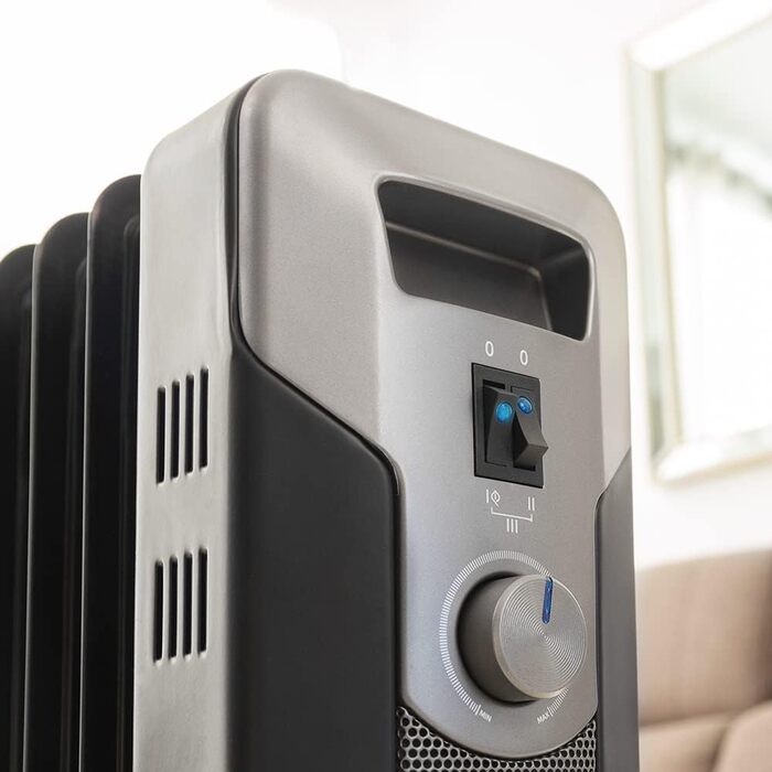 Масляний обігрівач Cecotec ReadyWarm 7000 Space Black 1500 Вт, 7 секцій, 3 режими потужності, відсік для кабелю, зручне керування, ручка, колеса та подвійна система безпеки, чорний, для приміщень до 15 м