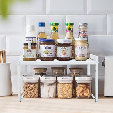 Розширювана полиця для шафи, 66 см, штабелюваний органайзер для кухонної стільниці, кухонна полиця для спецій, полиця для комори, регульований органайзер для шафи, полиця для зберігання речей для кухні та офісу (2 шт., білий M) Білий 2 шт., білий M