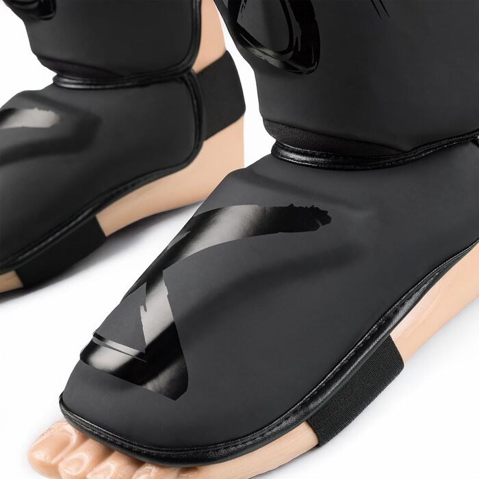 ЗБРОЇ Щитки для гомілок Unlimited 2.0, матово-чорні, для тренувань та змагань, високоякісна синтетична шкіра та ідеальна амортизація, муай-тай, K1, MMA, карате та кікбоксинг, 8