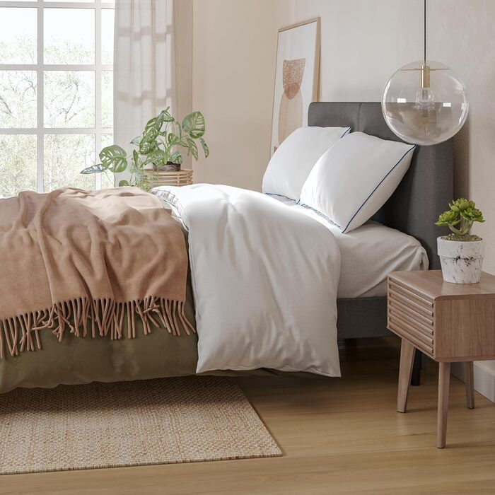 Класична пухнаста подушка Emma 80x80 Овальна подушка з мікрофібри, регульована, можна прати в пральній машині, ергономічна, мяка та для індивідуально регульованого комфорту сну. Класична 80x80 см