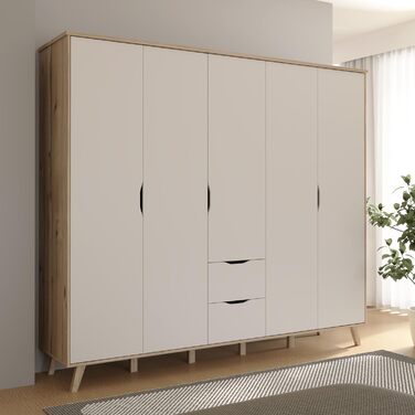 Гардероб Forte VANKKA 230, шафа в скандинавському стилі з 5 дверима на петлях та 2 шухлядами, витончені меблеві ніжки, інженерна деревина, декор дубовими дошками Білий, 228,8 см завширшки x 201,5 см заввишки x 52,7 см завглибшки. Біло-дубова 5-дверна шафа