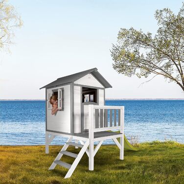 Ігровий будиночок AXI Beach Lodge XL в білому кольорі зі світло-зеленою гіркою Будиночок на палях з деревини FSC для дітей Невелика ігрова вежа для саду.