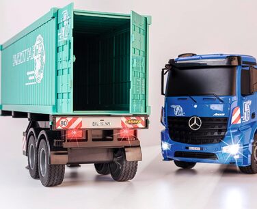 Радіокерований тягач Arocs з контейнером, модель 120, RTR (повністю готовий до використання), зі світлом та звуком, в комплекті батарейки та пульт керування, час роботи до 30 хвилин.