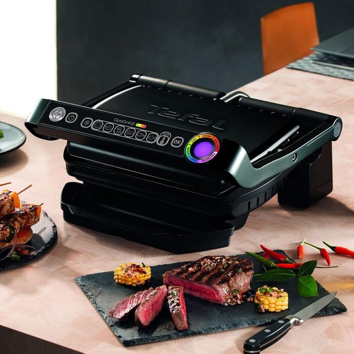 Контактний гриль TEFAL GC7128 OPTIGRILL 6 автоматичних програм Ручний режим з 4 режимами температури Ідеальні результати приготування на грилі завдяки вимірюванню товщини Чорний